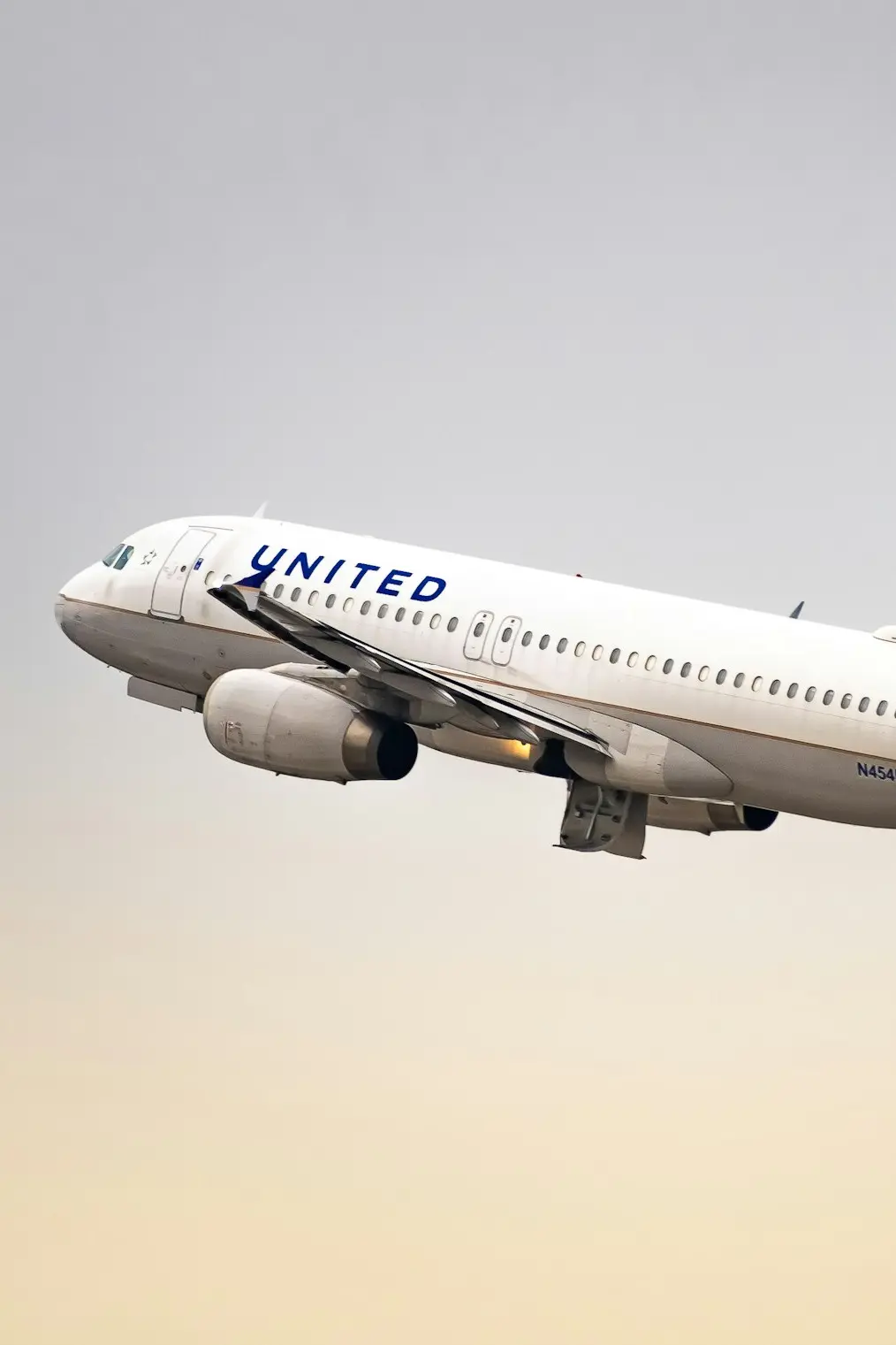 a united airlines plane flying in the sky